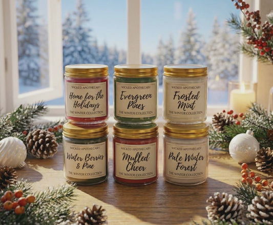 Set of candles with labels in a decorative setting with Christmas decor