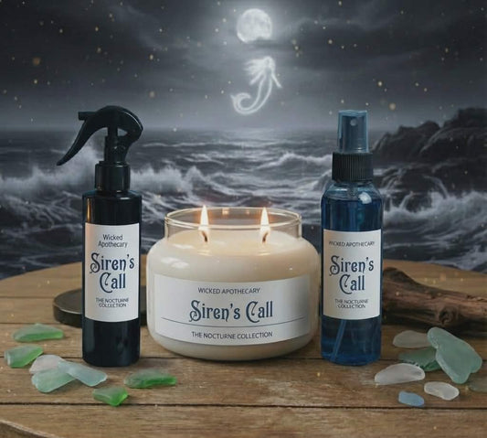 Siren's Call products on a wooden surface with a moonlit sea background