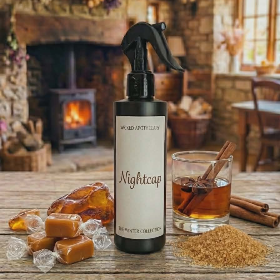 Bottle labeled 'Nightcap' with a warm, rustic background featuring a fireplace and wooden table.