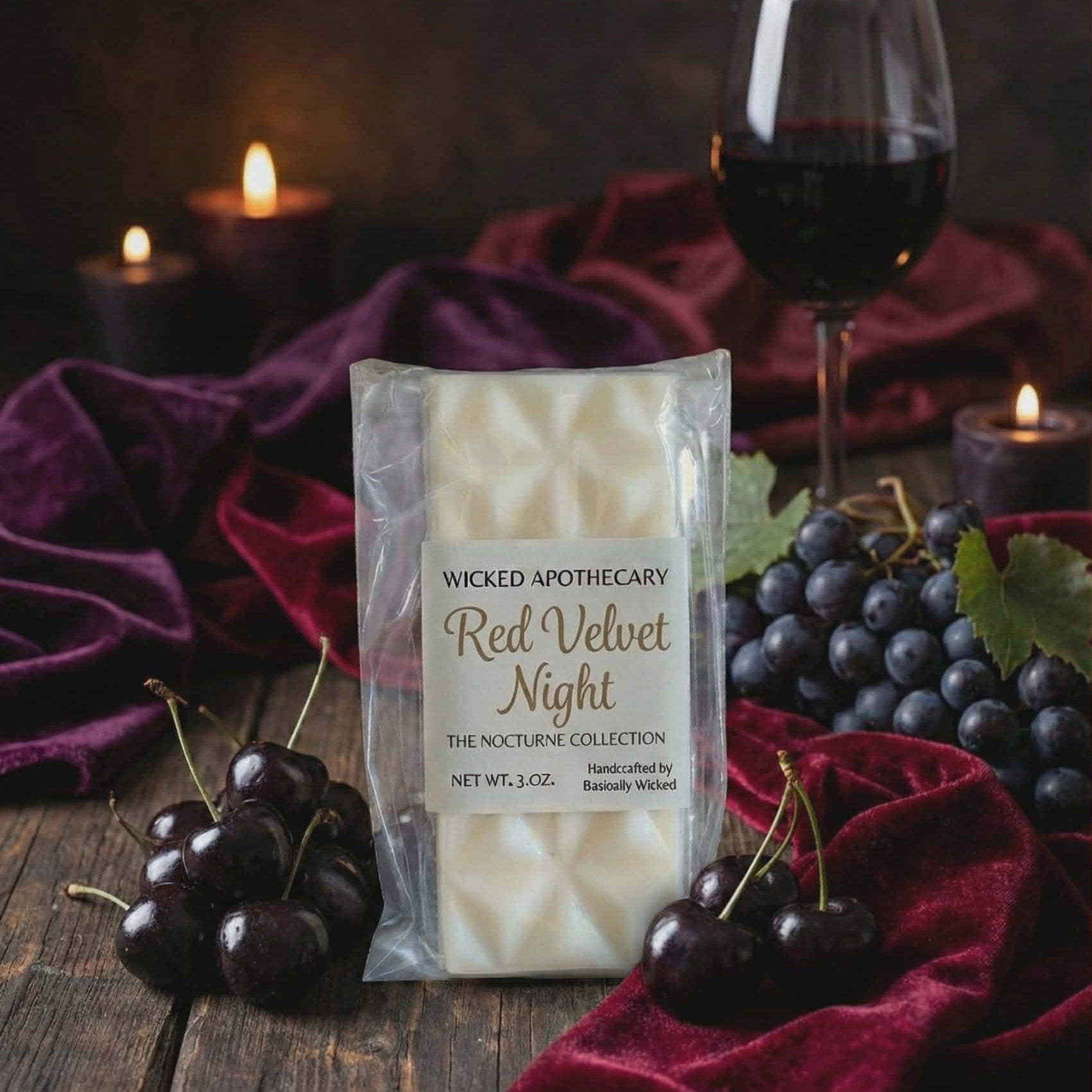 Wicked Apothecary Red Velvet Night candle packaging with grapes, cherries, and a glass of red wine on a dark background.