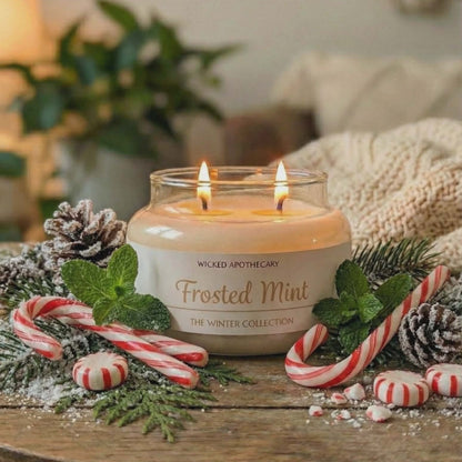Frosted Mint candle on a wooden table with Christmas decorations