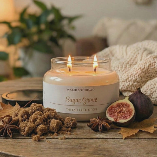 Wicked Apothecary candle with 'Sugar Grove' on a wooden table with figs and spices.